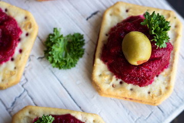 Beetroot relish on crackers. An original party snack.