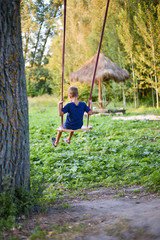child boy ride on  swing