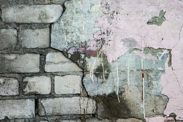 Old stucco crumbling from the wall