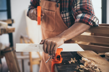 old carpenter man working in carpenter studio
