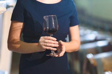 woman holding glass of wine