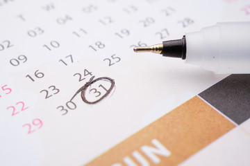 Fototapeta premium A business and finance conceptual with calendar and pen. Home loan, home insurance, family life assurance protection, financial mortgage for house building, and legacy planning investment concept