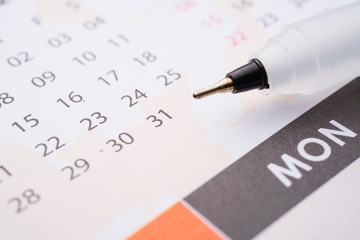 A business and finance conceptual with calendar and pen. Home loan, home insurance, family life assurance protection, financial mortgage for house building, and legacy planning investment concept