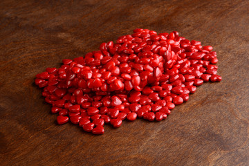 closeup pile of cinnamon hearts candies