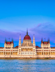 Fototapeta na wymiar The Hungarian Parliament Building located on the Danube River in Budapest Hungary at sunset.