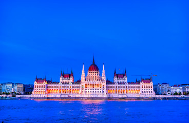 Fototapeta premium The Hungarian Parliament Building located on the Danube River in Budapest Hungary at sunset.