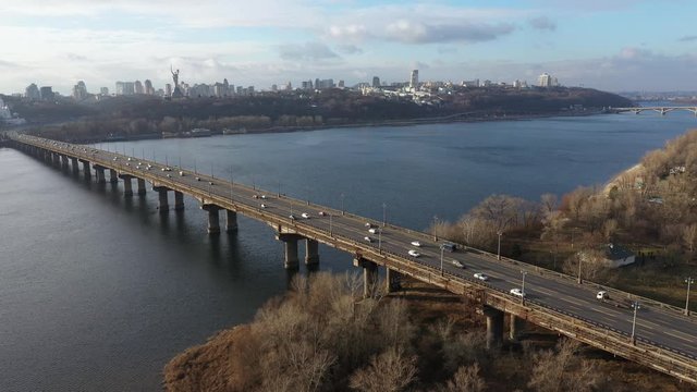 Beautiful Aerial View of City Traffic on the Bridge at the Sunny Day in winter.