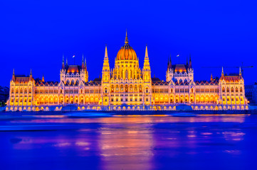 Fototapeta na wymiar The Hungarian Parliament Building located on the Danube River in Budapest Hungary at sunset.