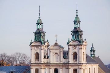 17th century church. Facade with statues. Cityscape.