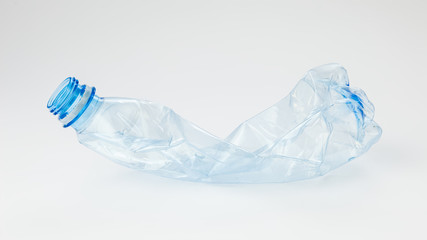Crumpled plastic bottle on a light background