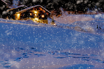 typical wooden cottage of the Alps in the Christmas atmosphere