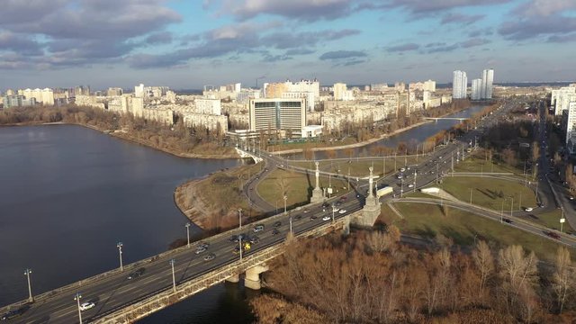 Beautiful Aerial View of City Traffic on the Bridge. City Traffic on the Patona Bridge. View of Rusanovskaya Embankment
