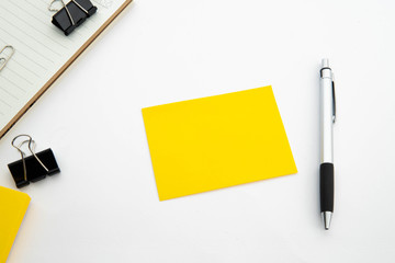 post it note, pen, cutter, note pad and clipper in isolate white background with space for text. office stationary equipment concept.