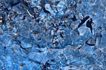 blue ice glass background, abstract texture of the surface of the ice on the glass, frozen seasonal water