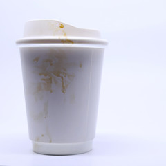 dirty brown stain on take away cup for hot coffee drink, paper mug on white background