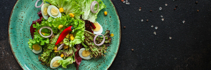 healthy salad corn, quail eggs, leaves mix salad  (healthy food, green vitamins) menu concept. food background. top view. copy space