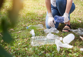 Close up, volunteer help garbage bag. Cleaning in the national park. Environment protection pollution.