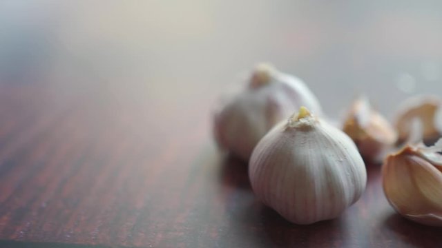 Garlic Bulb and garlic cloves on a wooden cutting Board. Organic farm food.