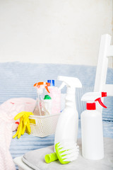 Spring home cleaning and housekeeping concept, Basket with cleaning items, utensils, supplies. Copy space