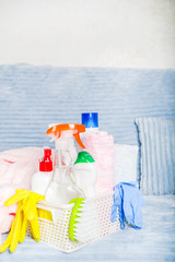 Spring home cleaning and housekeeping concept, Basket with cleaning items, utensils, supplies. Copy space