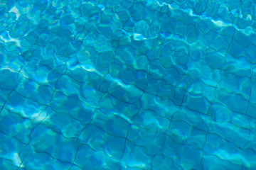 Blue water texture of swimming pool. ummer background. Texture of water surface. Clear Water give soothing effect.