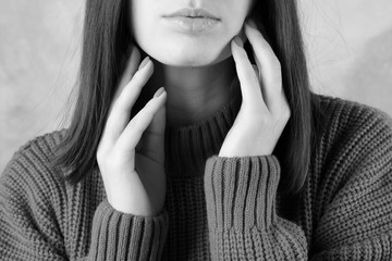 Young woman in warm, red sweater, space for text. Closeup