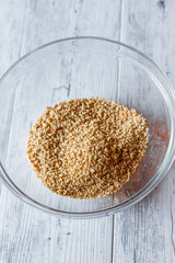 Raw dehydrated soy meat, soy protein, soy chunks or textured protein on wooden plate. Vegan food