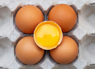 Fresh chicken eggs placed on a paper egg tray. Concept of high protein food, components of healthy food.