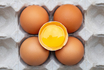 Fresh chicken eggs placed on a paper egg tray. Concept of high protein food, components of healthy food.