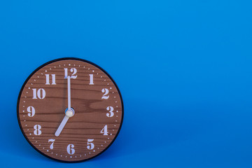 The clock at seven o'clock in the blue background