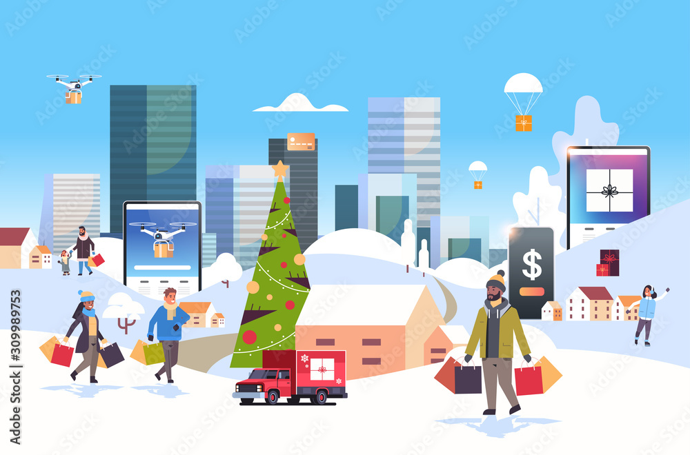 Wall mural santa claus carrying gift boxes mix race people with shopping bags walking outdoor preparing for christmas new year holidays men women using online mobile app winter cityscape background horizontal