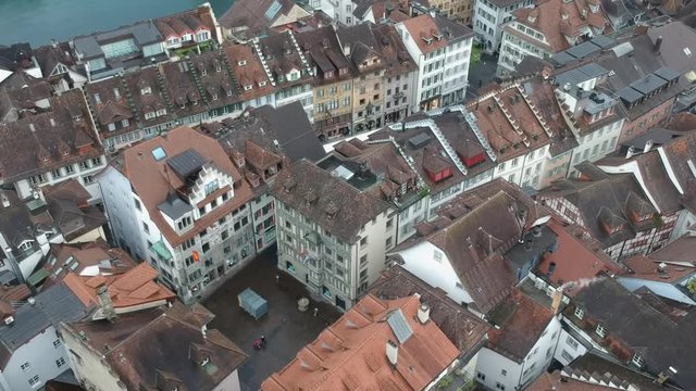 Aerial view over the rooftops in oldtown Luzern, Switzerland with forward moving pan