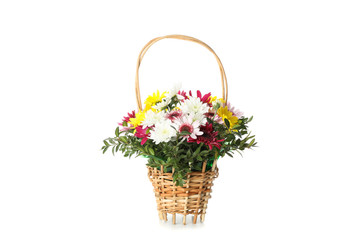 Wicker basket with beautiful flowers isolated on white background