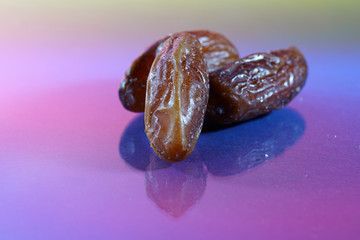 A date is the fruit of a date palm, photographed here in the studio as a detail