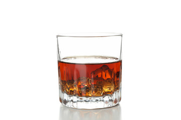 Glass of whiskey with ice cubes isolated on white background