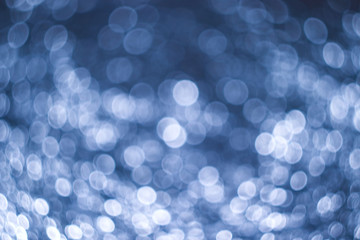Abstract background obtained from crumpled foil with moving lighting and a defocused camera....