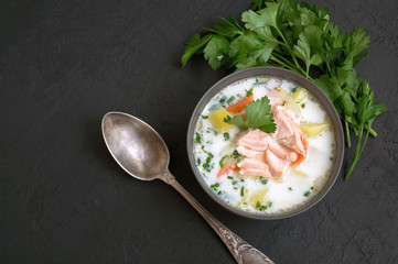 traditional salmon soup with vegetables and cream.