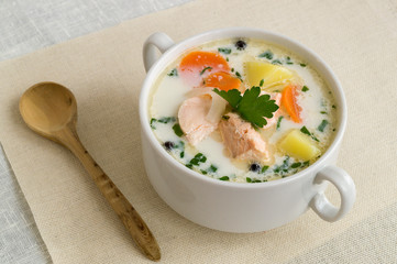 traditional salmon soup with vegetables and cream.
