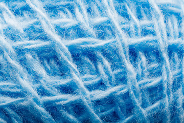 Wool yarn close-up colorful blue threads for needlework.