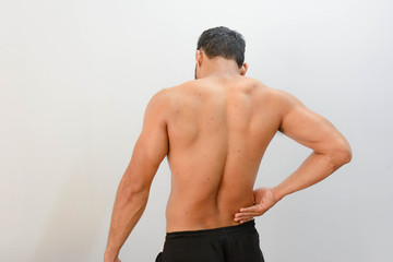 Man waist pain by exercise. 