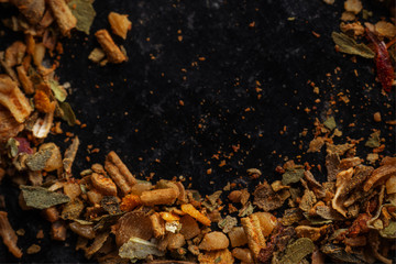 mix of spices close up on dark background