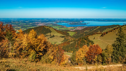 Beautiful alpine autumn or indian summer view with a far view of the chiemsee at the famous Kampenwand, Aschau im Chiemgau, Bavaria, Germany