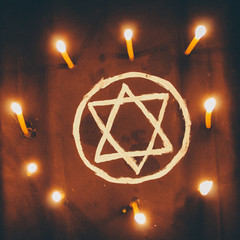 Pentagram circle with candles on floor. Occult, esoteric or divination concept. Mystic, Halloween...