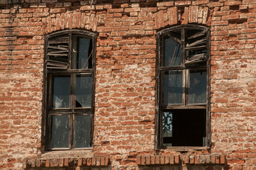 Old weathered rural countryside house clay brick wall closeup