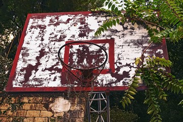 Fototapeta na wymiar weathered abandoned basketball hoop