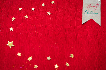 Christmas Theme Background. Christmas red textured background with copy space and decorated with paper made stars for greeting card, poster, advertising concept.