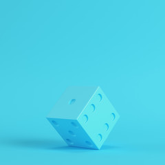 Dice on bright blue background in pastel colors. Minimalism concept
