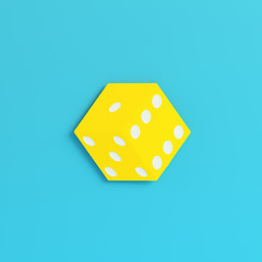 Yellow dice on bright blue background in pastel colors. Minimalism concept