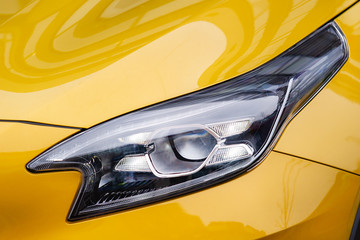 Front light of yellow car