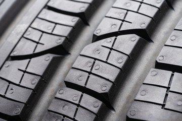 road tread protector all-season summer tire. close up. the tread blocks and sipes for evacuating...